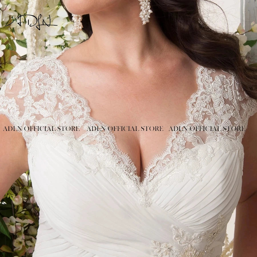 Elegant Plus Size Wedding Dresses V-Neck Cap Sleeves Robe De Mariage Sweep Train Appliqued Open Back Chiffon Bridal Gown