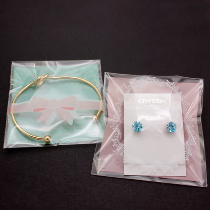 100PCS OPP Plastic Package Lovely Bowknot Design for Bracelets Earrings Necklace Rings DIY Jewelry Making 7 X 7cm