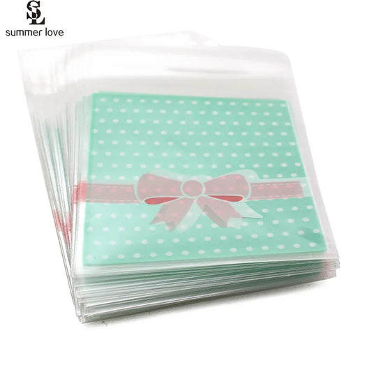100PCS OPP Plastic Package Lovely Bowknot Design for Bracelets Earrings Necklace Rings DIY Jewelry Making 7 X 7cm